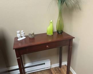 Side Table With Green Vases And Decor