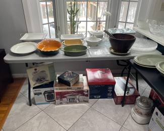 wood salad mixing bowl, serving dishes, baking dishes, cookware (unused boxes on the floor)