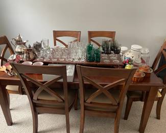 assortment of drinkware, containers, and silver pitchers