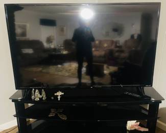 65” Roku Smart Television
    Nice Large Console with (2) Additonal Shelves 