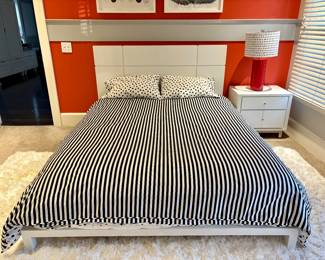 White laminate bed frame and nightstand. Lamp