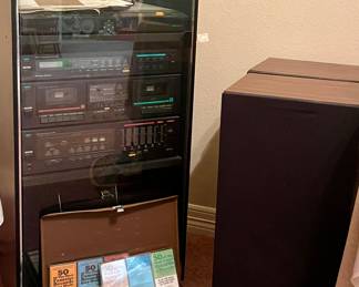 VINTAGE MCS STEREO SYSTEM FEATURING TURNTABLE, AMPLIFIER, SYNTHESIZED AM/FM STEREO, DUAL CASSETTE DECK AND HIGH FIDELITY SPEAKER SYSTEM IN MCM ROLLING STORAGE