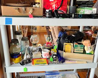 Vintage Phonola record player, cameras, old canning jar, Girl Scout camera, plastic bubble gum machine and more.