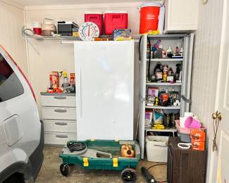 Lots of goodies in the garage including a Frigidaire freezer