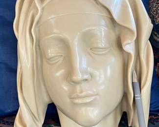 "Head of the Virgin" Details from the Pieta by Michelangelo. This is made of cold cast marble, refined and bonded with polymer resin. The marble is from the quarries at Carrara, Italy. The fountain pen is to show the scale of the piece.