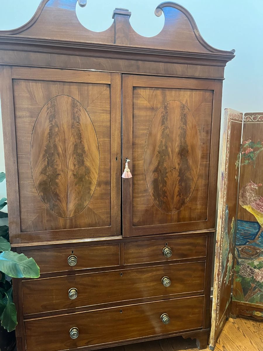$1400. Antique flame mahogany armoire. Four drawers below, hanging rod behind the doors. 50"w x 21"d x 88"h. Available for online purchase beginning Wednesday, January 22 starting at 7pm. All online purchases are final. Please see details on how to do it in our sale description.