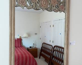 Vintage mirror for sale during in-person shopping.