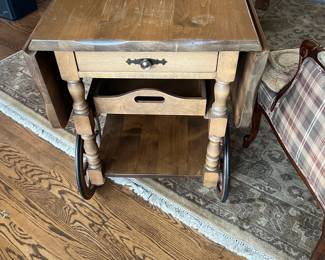 $180 Vintage tea trolley or bar/serving cart with a drawer and removable tray. Drop leaf on each side when up adds 20" to the width making it a 40 inch surface. As shown it is 20"w x 30" d x 29"h. As found close up in next photo. Available for online purchase beginning Wednesday, January 22nd starting at 7pm. All online purchases are final. Please see details on how to do it in our sale description.
