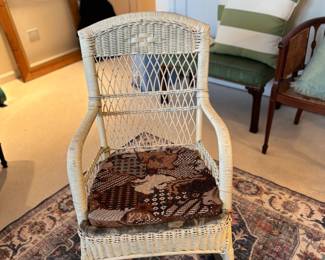 front view of the antique wicker rocker