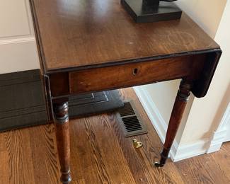 $240. Antique  drop leaf table.  Two drop leaf sides each adding 8.5" to the width.  Folded down the dimensions of the table are 21" w x 39" d x 30.5"h.  As found.   Available for online purchase beginning Wednesday, January 22 starting at 7pm.  All online purchases are final.  Please see details on how to do it in our sale description.   