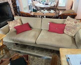 $880 Bracket back design American made mid-century sofa. Originally white naugahyde from the 1960's. 84"w x 31"d x 2.5"h. Mid Available for online purchase beginning Wednesday, January 22nd starting at 7pm. All online purchases are final. Please see details on how to do it in our sale description.