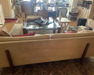 back view of the sofa - color is consistent - lighting makes it look different on the front.