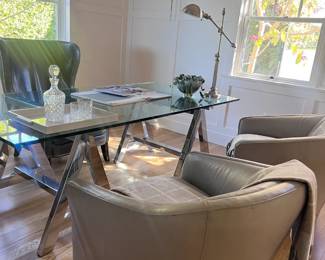 Heavy glass top chrome based Lawrence Table and Henredon leather bucket swivel chairs