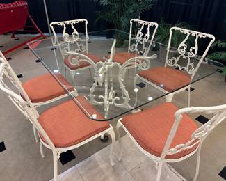 How pretty!  The chair bottoms are removable and could be easily recovered.  However, we steam cleaned these and believe me - they aren't bad at all!