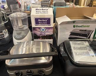 Many small kitchen appliances - lots of them new!  Notice the Berkey....