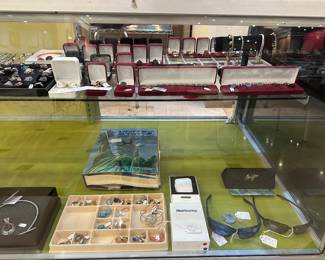 The box next to the Maui Jims, are hearing aids - never used.