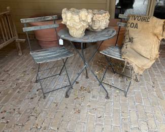 Bistro table and chairs, interesting pots 