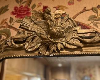 Close up of carving on gilt wood mirror