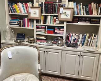 Mostly cookbooks and religious books, more silver plate serving pieces , rug is 4’8” x 7’ hand woven Sarkhoy