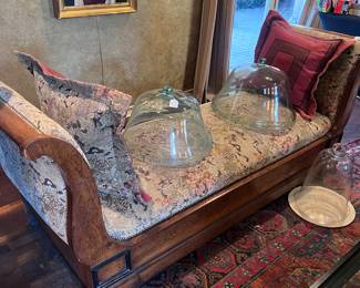 Antique chaise lounge with pillows, antique French garden cloches