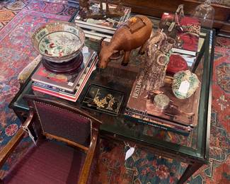 Antique French child’s chair, metal and glass coffee table with amazing accessories and coffee table books, 8’10” x 11’6” antique Soumack rug