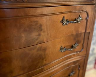 Close up of antique walnut French Provincial Louis XV serpentine high boy dresser