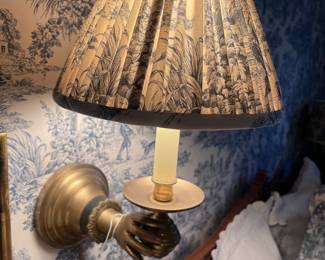 Brass hand sconce with custom toile shade