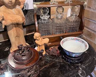 Left to right: wood carved angel, wood carved girl, antique English oak 3-bottle tantalus, Japanese Koro (incense burner), rose medallion bowl