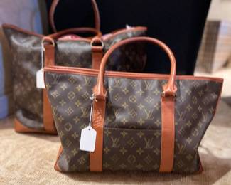 Two sizes of the Louis Vuitton weekend monogram canvas bags