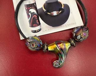 This is one of over 800 necklaces belonging to the estate.  There are over 80 costume and sterling rings.  Most of the costume jewelry is designer items like the above kaleidoscope bead necklace.