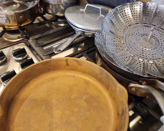 Odd photo....Cast Iron and other pots and pans. 