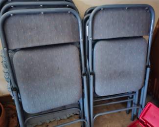 lots of folding chairs and folding tables  