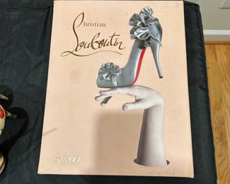 C156 - $20 - Christian Louboutin Coffee Table Book. Surface Shows some marks - inside is excellent. 