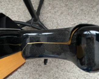 C16 - $250 - Fender Stratocaster Serial # MZ6076392. Model #0134600306. FENDER STD STRAT RW BLK.  05/2006. Has significant cracking all around the black case that surrounds the wooden guitar body. 