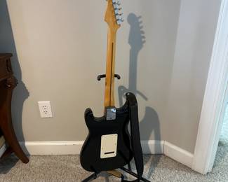 C16 - $250 - Fender Stratocaster Serial # MZ6076392. Model #0134600306. FENDER STD STRAT RW BLK.  05/2006. Has significant cracking all around the black case that surrounds the wooden guitar body. 