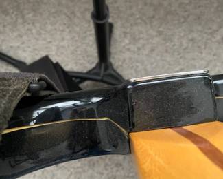 C16 - $250 - Fender Stratocaster Serial # MZ6076392. Model #0134600306. FENDER STD STRAT RW BLK.  05/2006. Has significant cracking all around the black case that surrounds the wooden guitar body. 