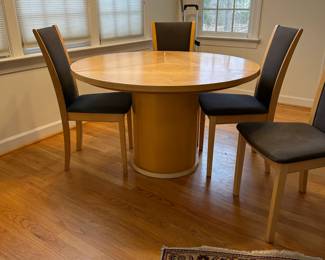 C44 - $650. Skovby Model SM32MB Maple. Made in Denmark. Extending Segmental Pedestal Dining Table. Table measures 47" round x 28.5" tall. With Pop Up leaves it is 57" wide. Chairs need cleaned or reupholstered.  Table shows signs of wear. By turning the turntable under the tabletop the three leaves move synchronously to a position that makes room for the extension leaves in the base. When light pressure is applied the extension leaves unfold by means of a spring placed under the triangle in the middle of the table. 