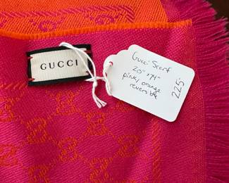 C107 - $225. Gucci Wool Scarf. Measures 20" x 74". Pink & Orange Reversible. No issues noted. 