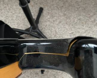 C16 - $250 - Fender Stratocaster Serial # MZ6076392. Model #0134600306. FENDER STD STRAT RW BLK.  05/2006. Has significant cracking all around the black case that surrounds the wooden guitar body. 