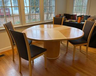 C44 - $650. Skovby Model SM32MB Maple. Made in Denmark. Extending Segmental Pedestal Dining Table. Table measures 47" round x 28.5" tall. With Pop Up leaves it is 57" wide. Chairs need cleaned or reupholstered.  Table shows signs of wear. By turning the turntable under the tabletop the three leaves move synchronously to a position that makes room for the extension leaves in the base. When light pressure is applied the extension leaves unfold by means of a spring placed under the triangle in the middle of the table. 