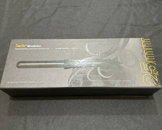 C128 - $20. Sedu Revolution 25mm curling iron in box. Clipless curling iron. 