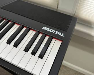 C13 - $85 - Alesis Recital Digital Piano with Full Size Keys. Includes Stand & Stool. Does have  a little bit of sticker residue on the keys from learning to play!