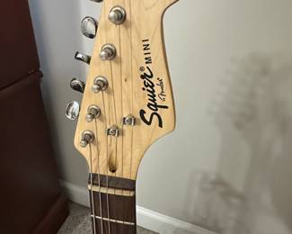 C15 - $100. Squier Mini by Fender with Stand. 