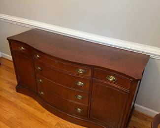 C31 - $250. Bassett Buffet. Measures 62.5" wide x 21.5" deep x 33" tall. Monticello. All drawers slide. Small area on the top that has surface damage - see photo. 