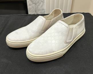 C119 - $125. Size 34.5. Gucci Slip On White Leather Sneakers. Shows minimal wear. 