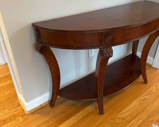 C29 - $75. Demi Lune Entry Table. Measures 52" wide x 18" deep x 30.5" tall. 