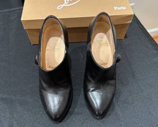 C121 - $225. Christian Louboutin C'est Moi Black Leather Button Ankle Boots with Box. 