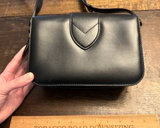 C106 - $1600. Louis Vuitton Pont 9 Black. Purchased by my client at the LV Store in LA. Certificate of Authenticity provided from Real Authentication. Only used a couple times. Overall in *very* good condition. There is a 1" scuff in the leather on the back - that is the only issue noted. Strap is adjustable. Gold accents are in very good condition. Gorgeous bag!