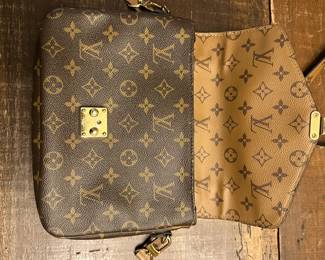 C105 - $1450. Louis Vuitton Pochette Metis Monogram Reverse. With Box and Authenticity Certificate. Has minor cracking and scratches on the metal. If you would like to see prior to committing please let me know when you reach out. 