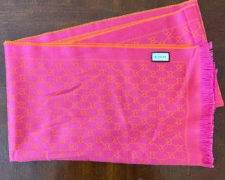 C107 - $225*. Gucci Wool Scarf. Measures 20" x 74". Pink & Orange Reversible. No issues noted. 